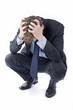Stressed businessman with hands in his hair