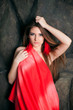 Girl in red dress with red feathers