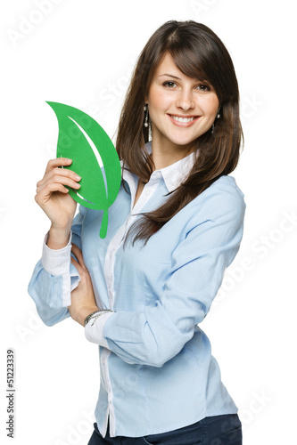 Photo: Happy young woman holding eco leaf Happy young woman holding eco leaf