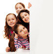 Group of girls behind advertising board