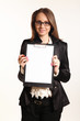 Cute young business woman with clipboard isolated in white backg