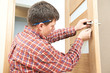 carpenter at door lock installation