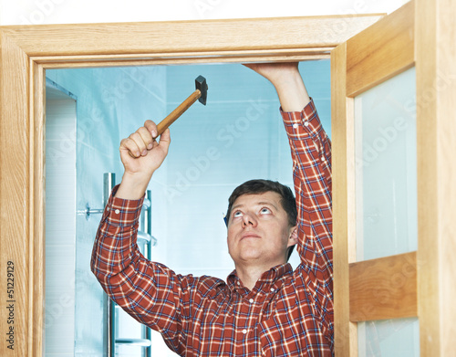 Photo: carpenter at door installation carpenter at door installation