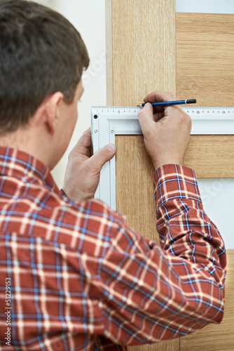 Photo: carpenter at door installation carpenter at door installation