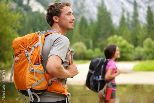 Photo: Hikers - people hiking, man looking in Yosemite Hikers - people hiking, man looking in Yosemite