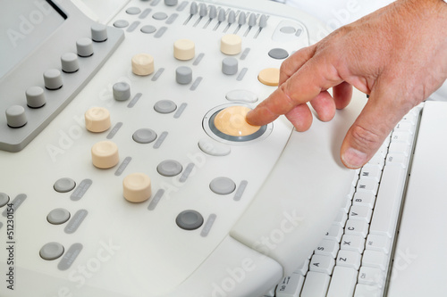 Photo: Hand Operating Ultrasound Machine Hand Operating Ultrasound Machine