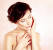 Beautiful Young Woman touching her Face. Skincare