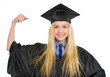 Happy young woman in graduation gown showing biceps