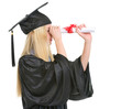 Woman in graduation gown looking into distance through diploma