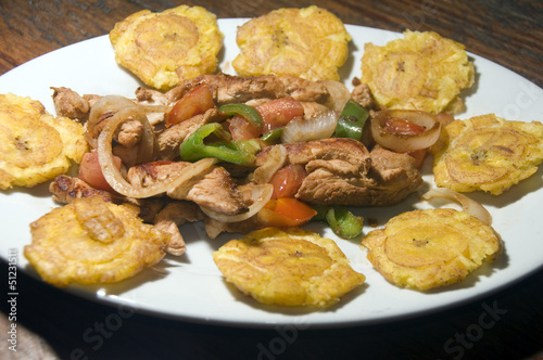 Photo: grilled chicken fajita food with local tostones fried plantains grilled chicken fajita food with local tostones fried plantains