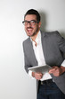 Cheerful salesman using digital tablet