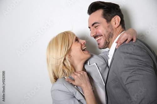 Photo: Trendy loving couple on white background Trendy loving couple on white background