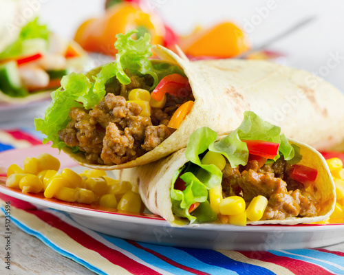 Photo: tortilla wraps with meat and fresh vegetables tortilla wraps with meat and fresh vegetables