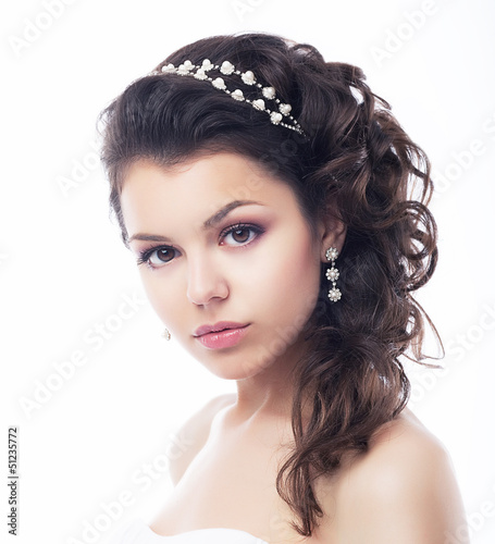 Photo: Beautiful Face of Luxurious Wealthy Woman with Jewelry. Elegance Beautiful Face of Luxurious Wealthy Woman with Jewelry. Elegance