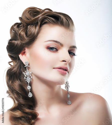 Photo: Delight. Posh Woman with Diamond Earrings. Platinum Jewelry Delight. Posh Woman with Diamond Earrings. Platinum Jewelry