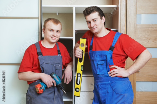 Photo: Portrait of wardrobe installation carpenters Portrait of wardrobe installation carpenters