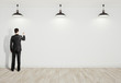 man drawing on wall
