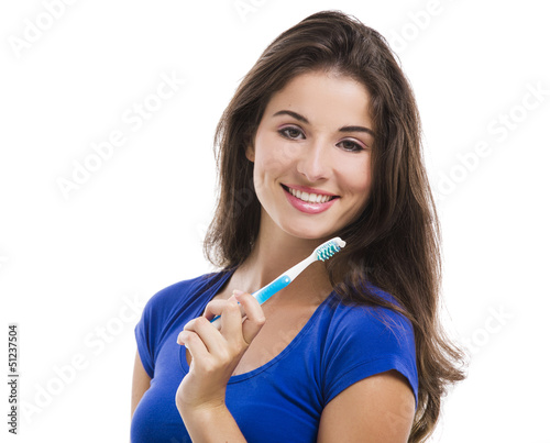 Photo: Beautiful woman with a toothbrush Beautiful woman with a toothbrush