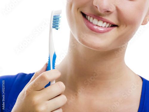 Photo: Beautiful woman with a toothbrush Beautiful woman with a toothbrush