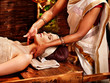 Woman having ayurveda spa treatment.