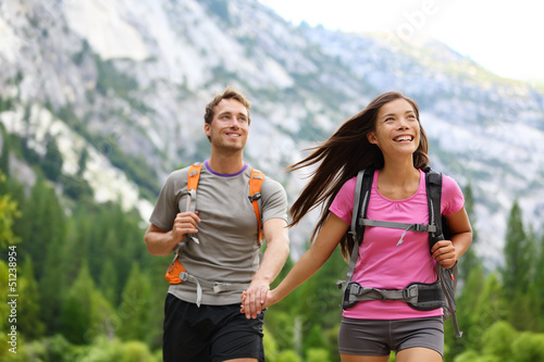 Photo: Happy couple of hikers hiking in Yosemite Happy couple of hikers hiking in Yosemite
