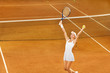 female tennis player celebrating victory