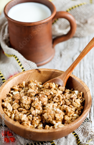Photo: Muesli in wooden plate and milk Muesli in wooden plate and milk