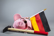 Robbed piggy bank of Germany with hammer