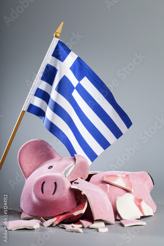 Photo: Robbed piggy bank with Greece flag Robbed piggy bank with Greece flag
