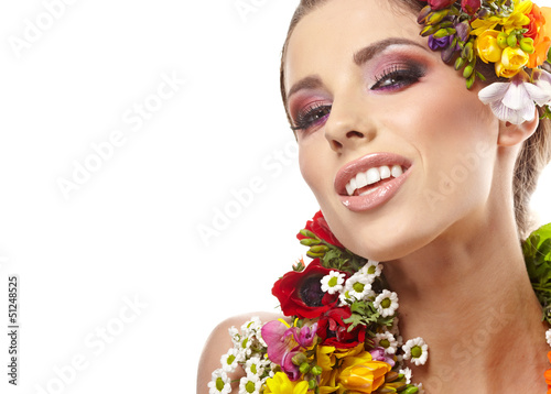Photo: Beautiful woman with flower wreath. Space for text. Beautiful woman with flower wreath. Space for text.
