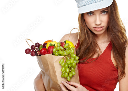 Photo: Young woman with a grocery shopping bag. Isolated on white backg Young woman with a grocery shopping bag. Isolated on white backg