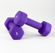 two 5 pound weights on a white background with copy space.