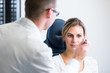 Photo: Optometry concept - pretty young woman having her eyes examined Optometry concept - pretty young woman having her eyes examined
