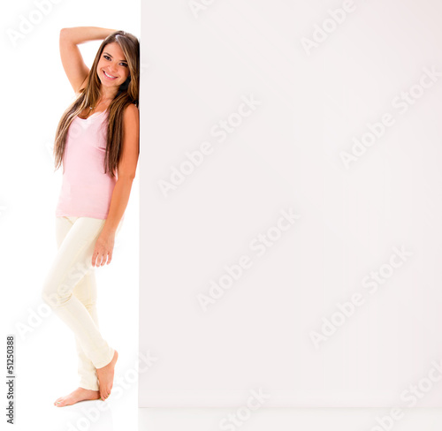 Photo: Woman leaning on a banner Woman leaning on a banner
