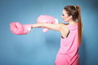 Female boxer model with big fun pink gloves