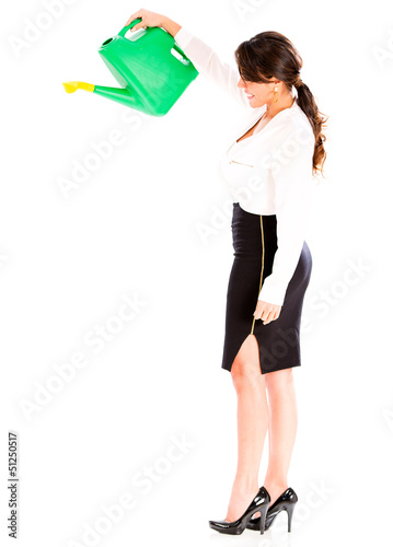 Photo: Business woman with a water can Business woman with a water can