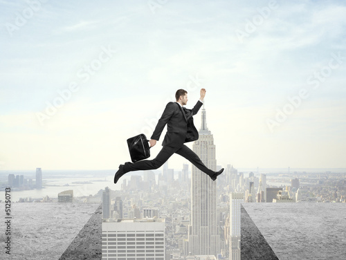 Photo: man jumping on roof man jumping on roof