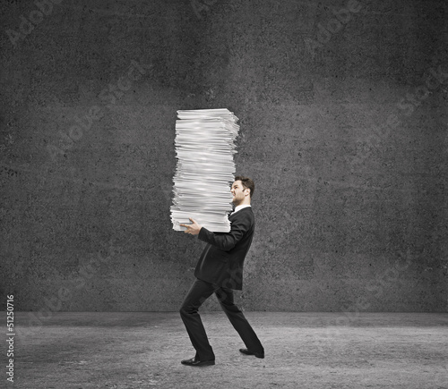 Photo: man holding paper man holding paper