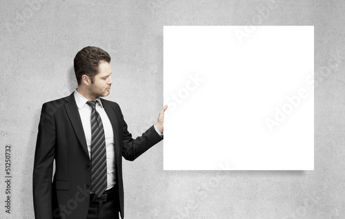 Photo: man holding card man holding card