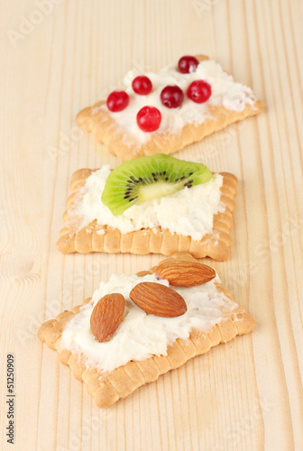 Photo: Tasty canapes with cheese, kiwi and cranberry, almond, Tasty canapes with cheese, kiwi and cranberry, almond,