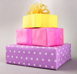 Bright gifts with bows on grey background