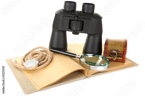 Photo: Black modern binoculars with old notebook isolated on white Black modern binoculars with old notebook isolated on white