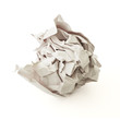 Crumpled gray paper ball over white background