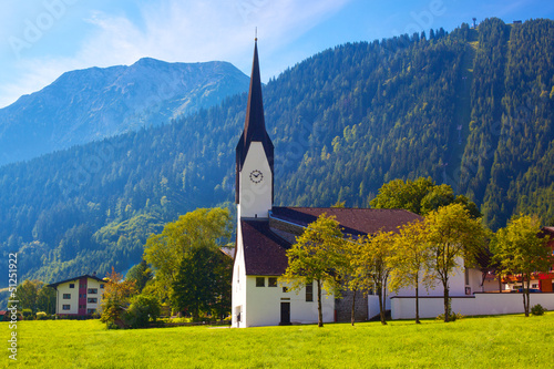 Photo: Alps village with cathedral Alps village with cathedral