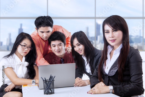 Photo: Business manager and team at office Business manager and team at office