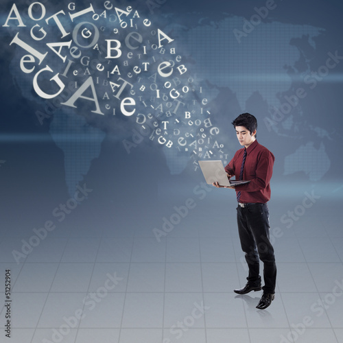 Photo: Businessman email using laptop on world map Businessman email using laptop on world map