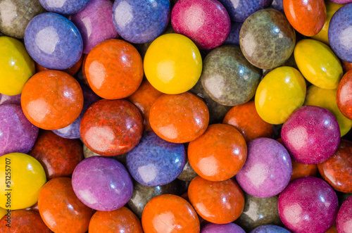 Photo: Colorful chocolate candies on table Colorful chocolate candies on table
