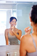 woman brushing teeth