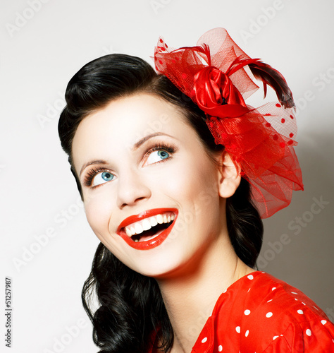 Photo: Vitality. Cheerful Young Woman with Red Bow enjoying. Pleasure Vitality. Cheerful Young Woman with Red Bow enjoying. Pleasure