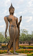 Walking Buddha statue in  Sukhothai Historical Park, Thailand